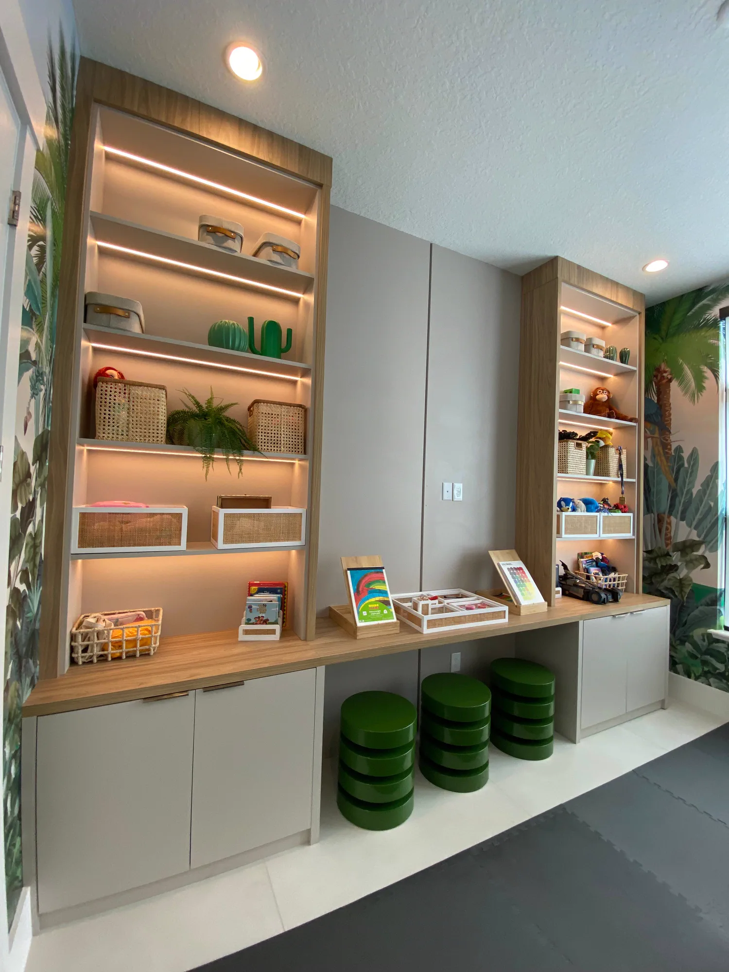 Playroom with custom built-ins and integrated lighting